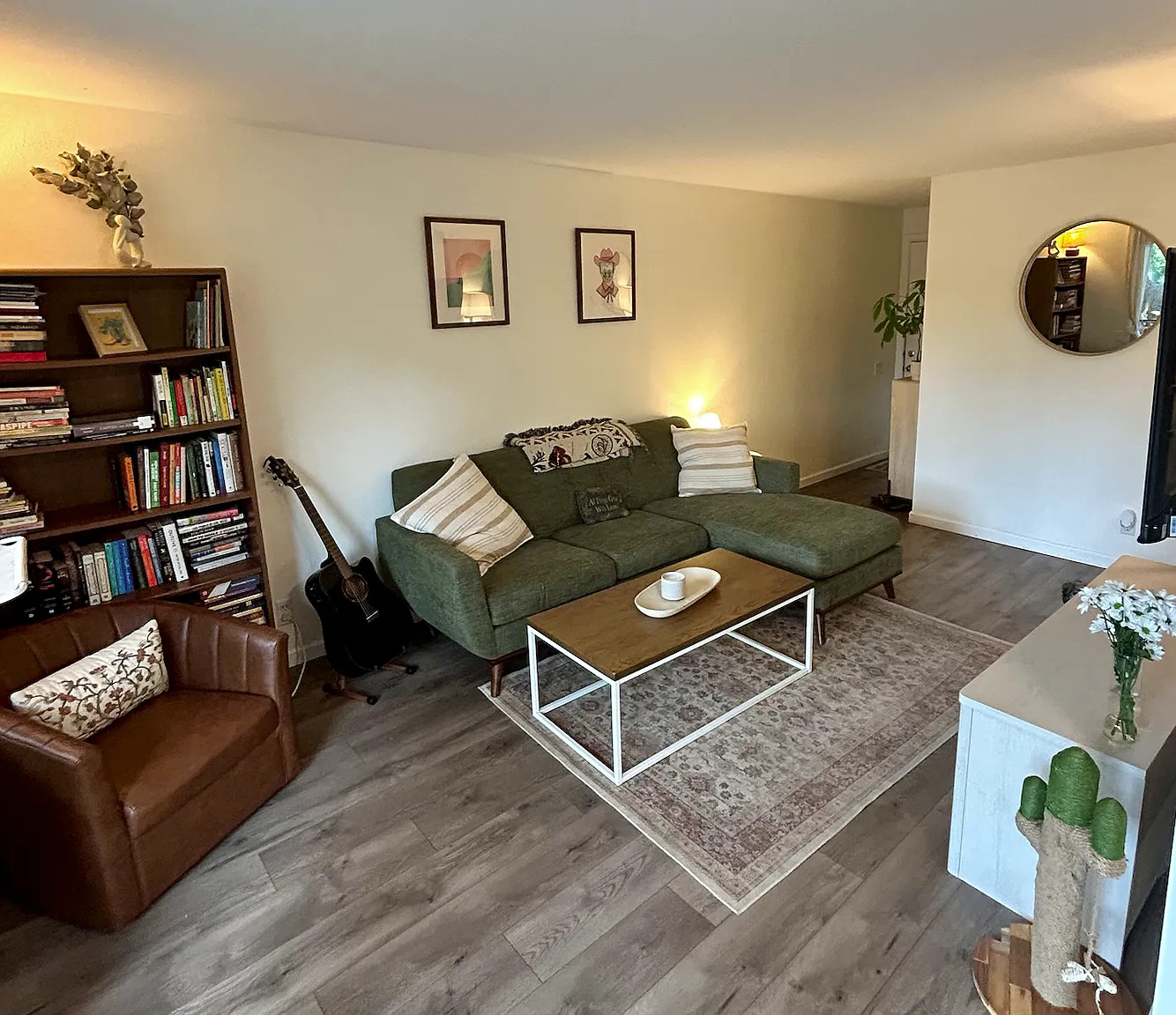 620 South 1st Street, Unit 106 Austin, TX 78704 - Photo 1 of 13 a living room with furniture and a book shelf