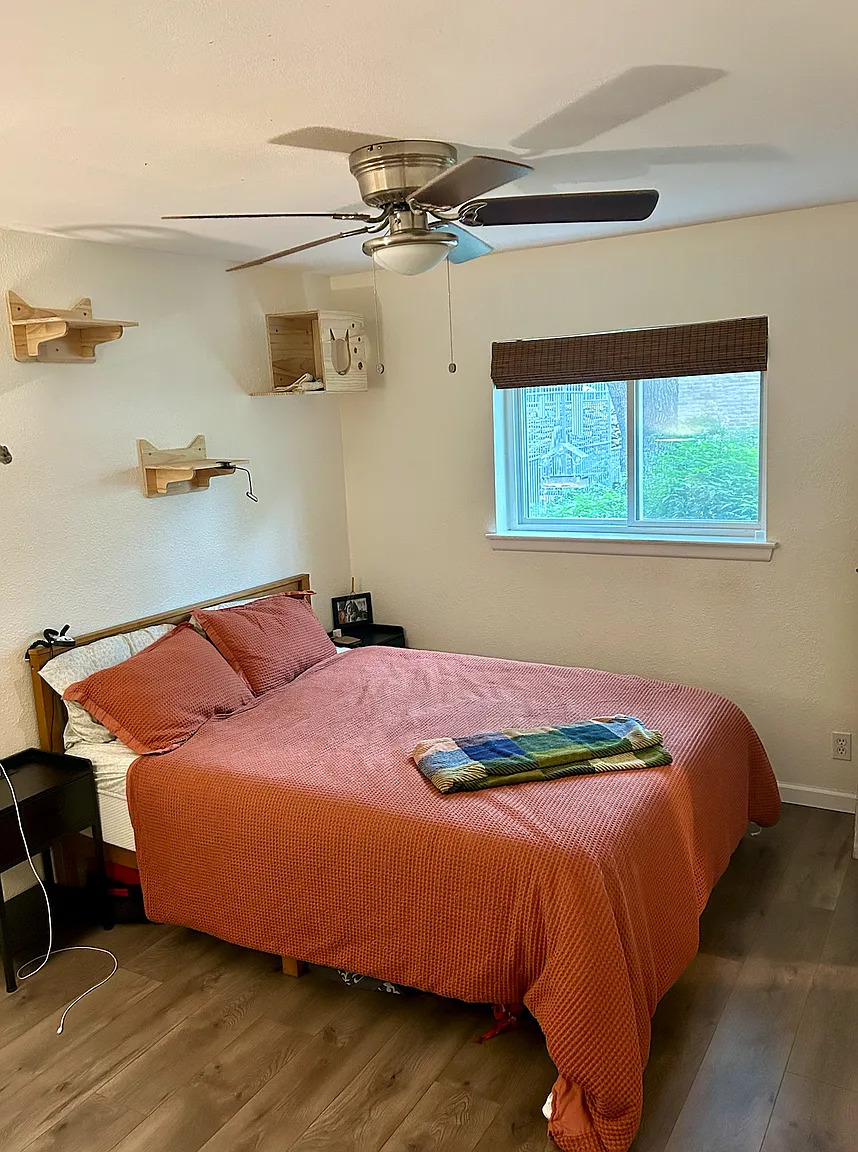 620 South 1st Street, Unit 106 Austin, TX 78704 - Photo 6 of 13 a bedroom with a bed and window