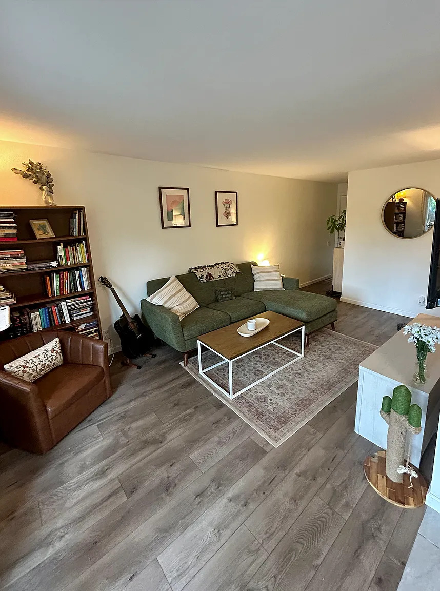 620 South 1st Street, Unit 106 Austin, TX 78704 - Photo 9 of 13 a living room with furniture and wooden floor