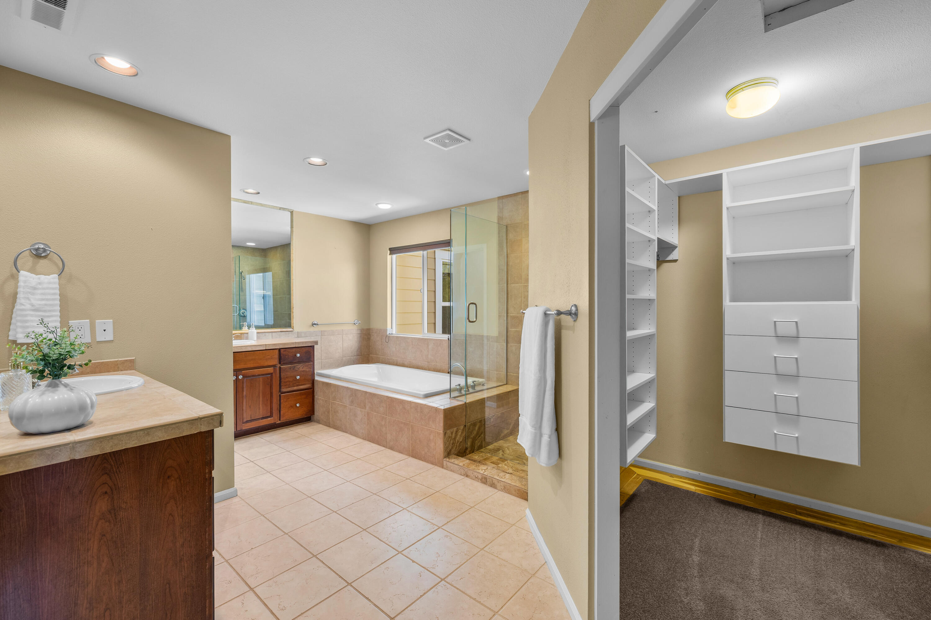 19307 Blue Lake Loop Bend, OR 97702 - Photo 29 of 58 a bathroom with a tub sink and mirror