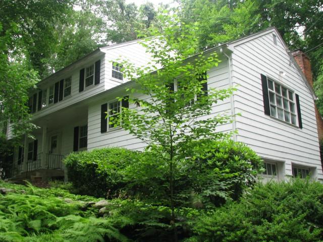23 Bryants Brook Road Wilton, CT 06897 - Photo 1 of 1 a view of a house with a yard and plants