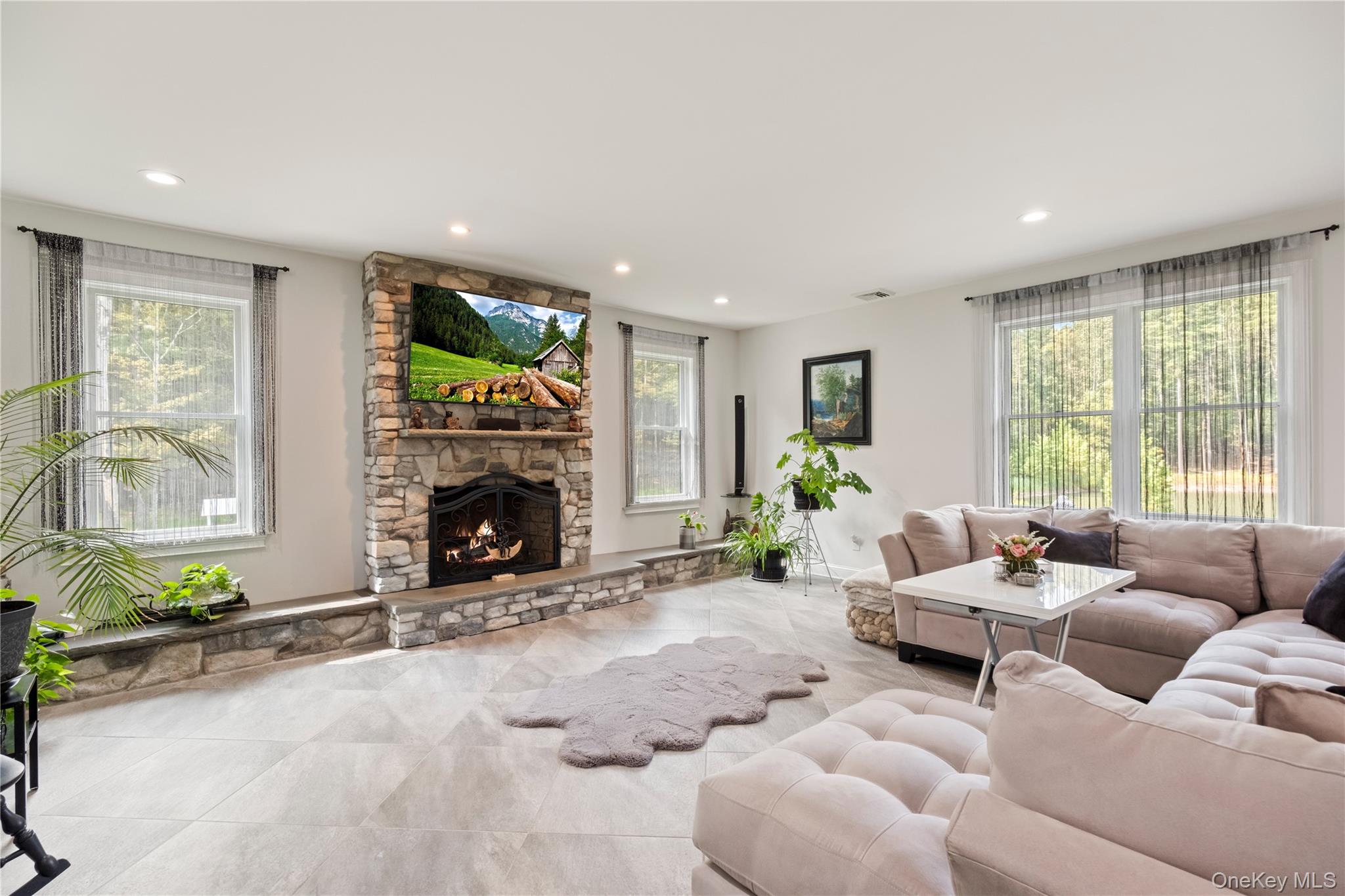 174 Webber Road Coxsackie, NY 12058 - Photo 12 of 50 a living room with furniture fireplace and window