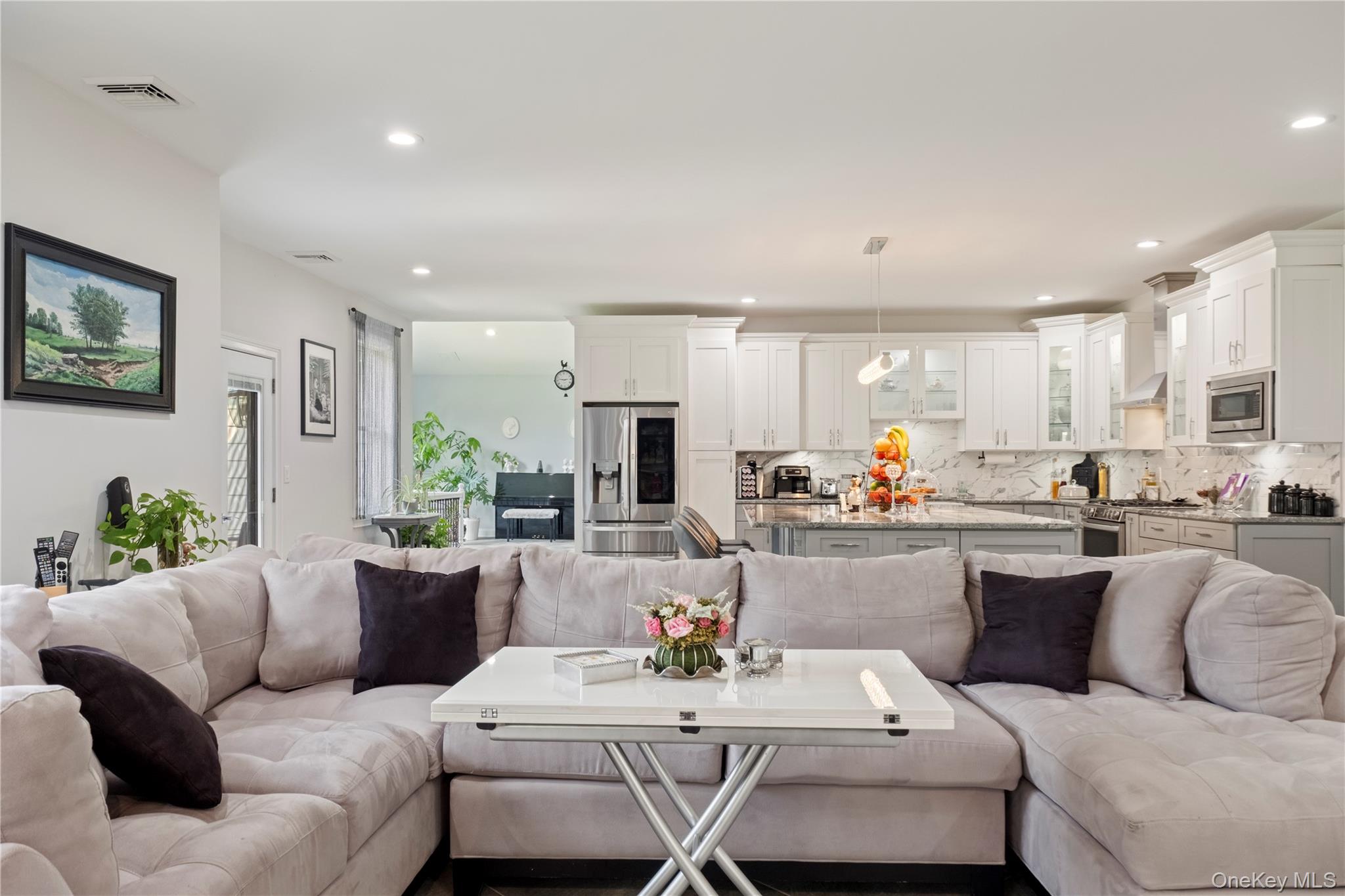 174 Webber Road Coxsackie, NY 12058 - Photo 13 of 50 a living room with furniture kitchen view and a potted plant