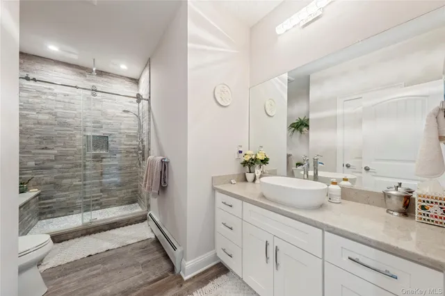 a spacious bathroom with double sink and shower