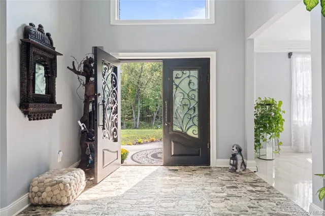a view of a bedroom with a bed and windows
