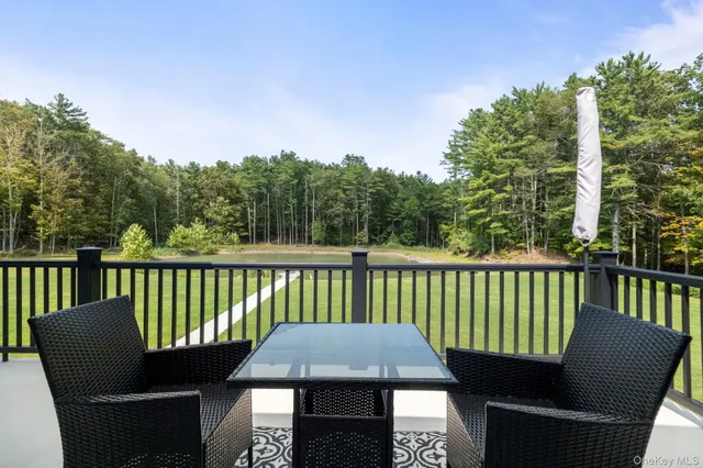 a view of a chair and table in the balcony
