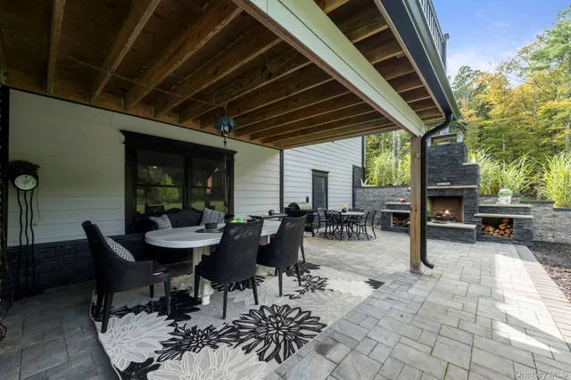 a view of a dinning table and chairs in the patio