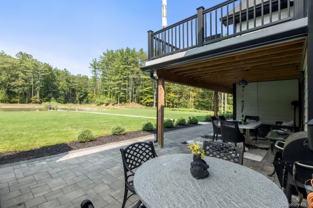 a view of a backyard with sitting area