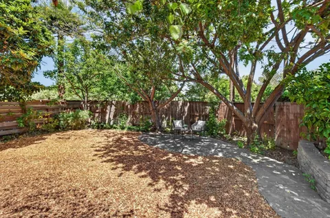 a backyard of a house with lots of green space