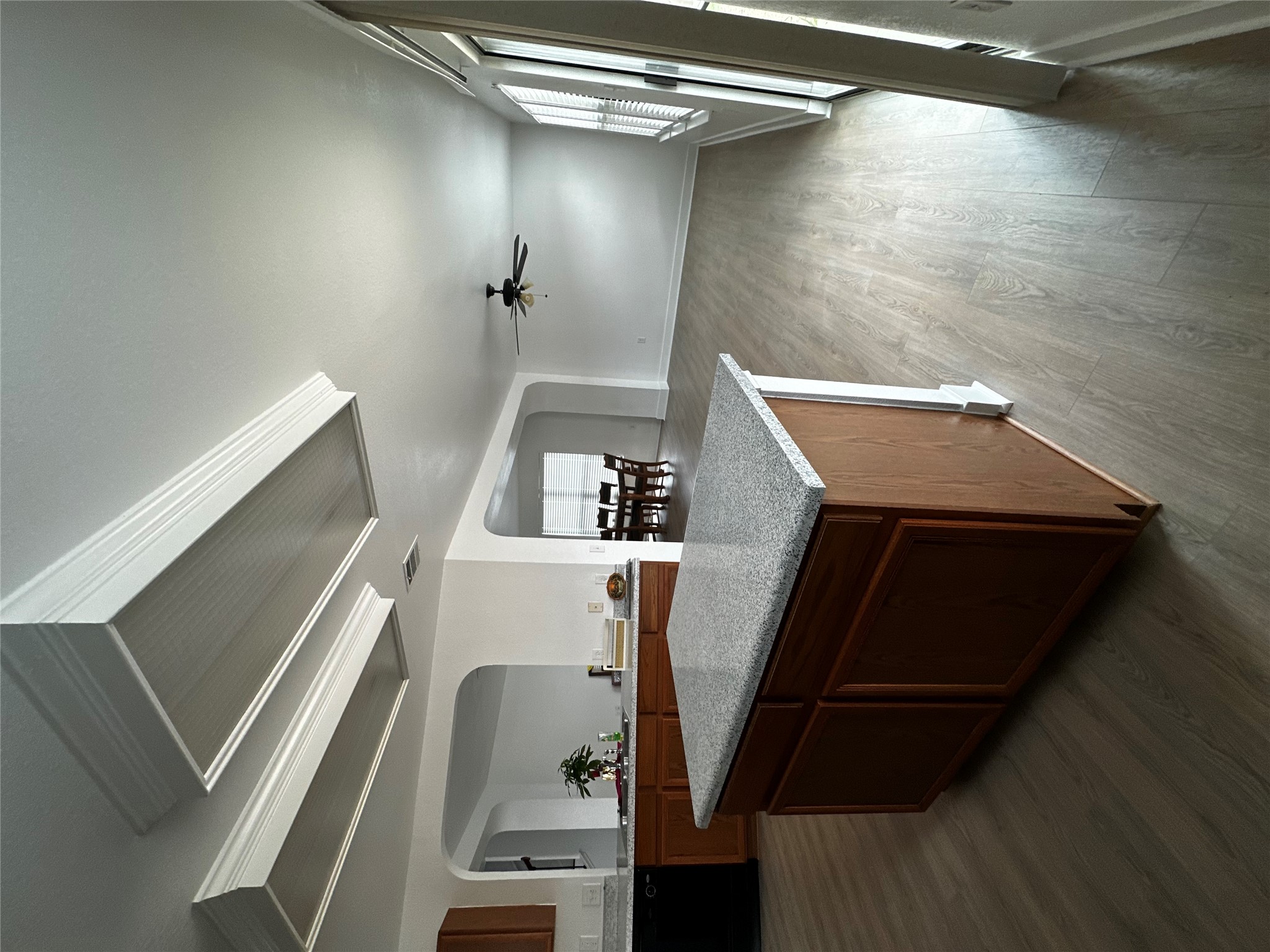 8016 Bannock Lane Austin, TX 78747 - Photo 32 of 32 a kitchen with wooden cabinets and sink