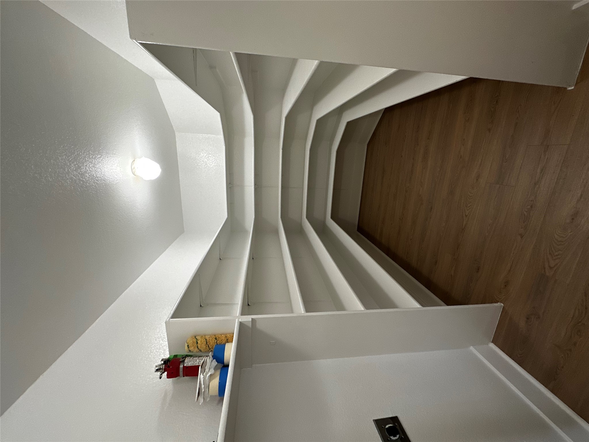 8016 Bannock Lane Austin, TX 78747 - Photo 10 of 32 a storage room with wooden floor