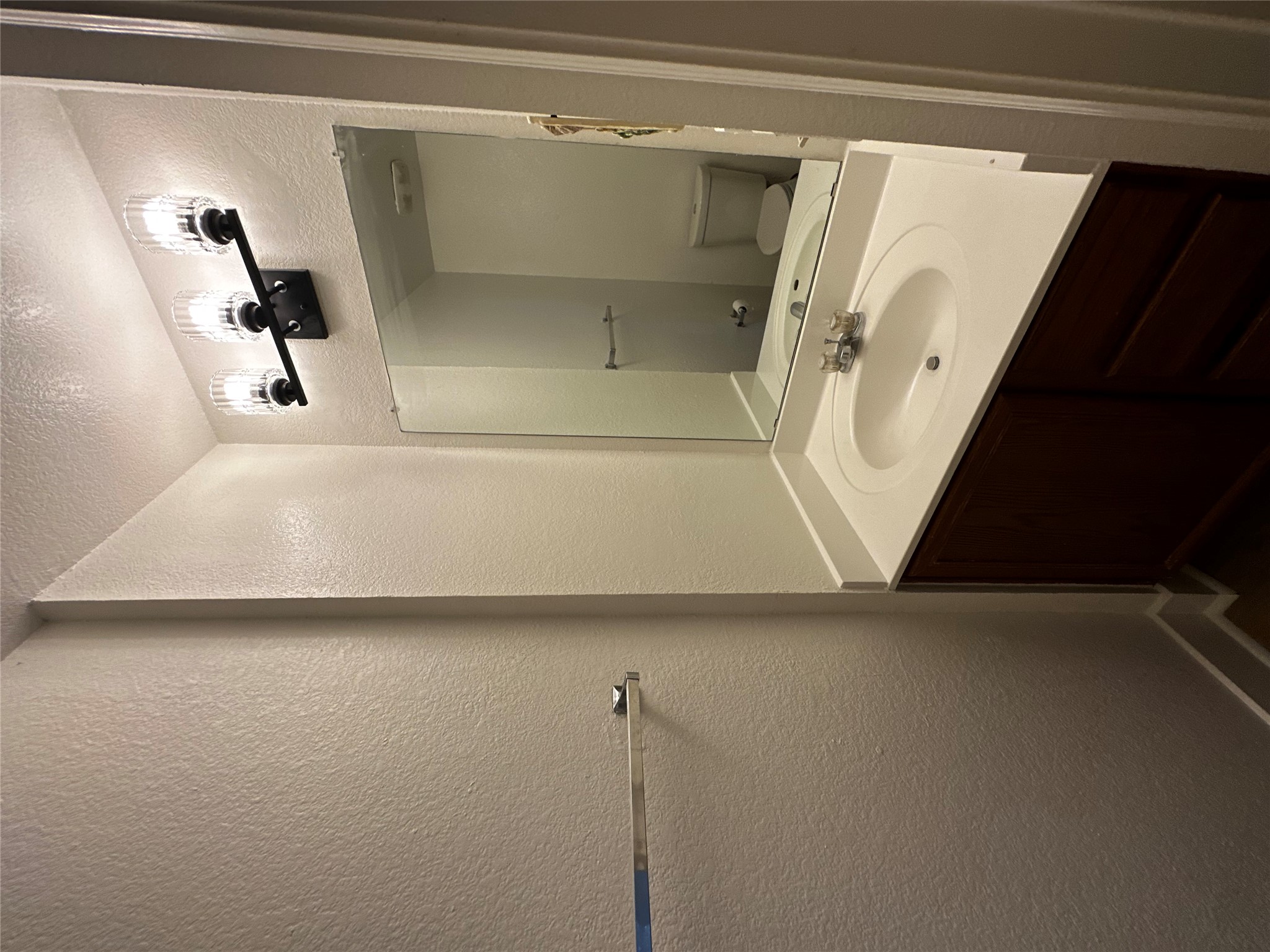 8016 Bannock Lane Austin, TX 78747 - Photo 12 of 32 a bathroom with a sink and a mirror