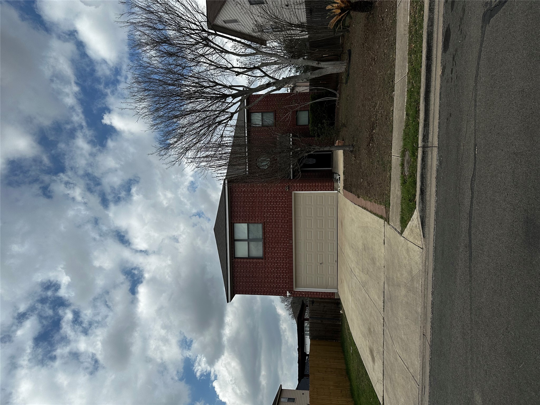 8016 Bannock Lane Austin, TX 78747 - Photo 2 of 32 Traditional-style home featuring brick siding, driveway, and a garage