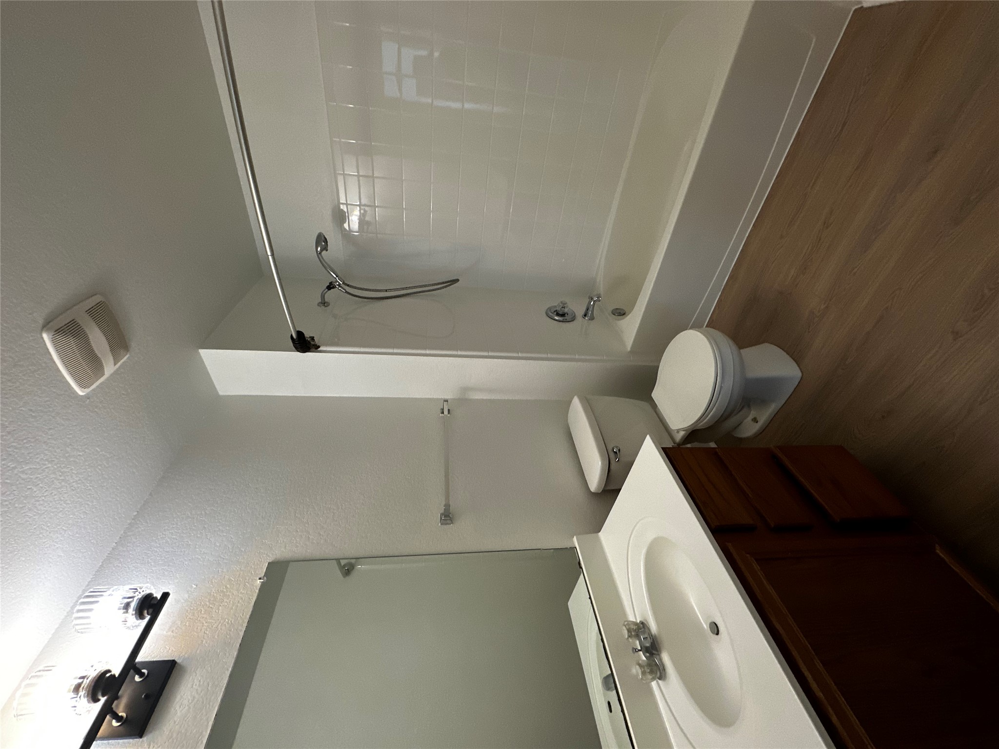 8016 Bannock Lane Austin, TX 78747 - Photo 22 of 32 a bathroom with a sink a toilet and shower