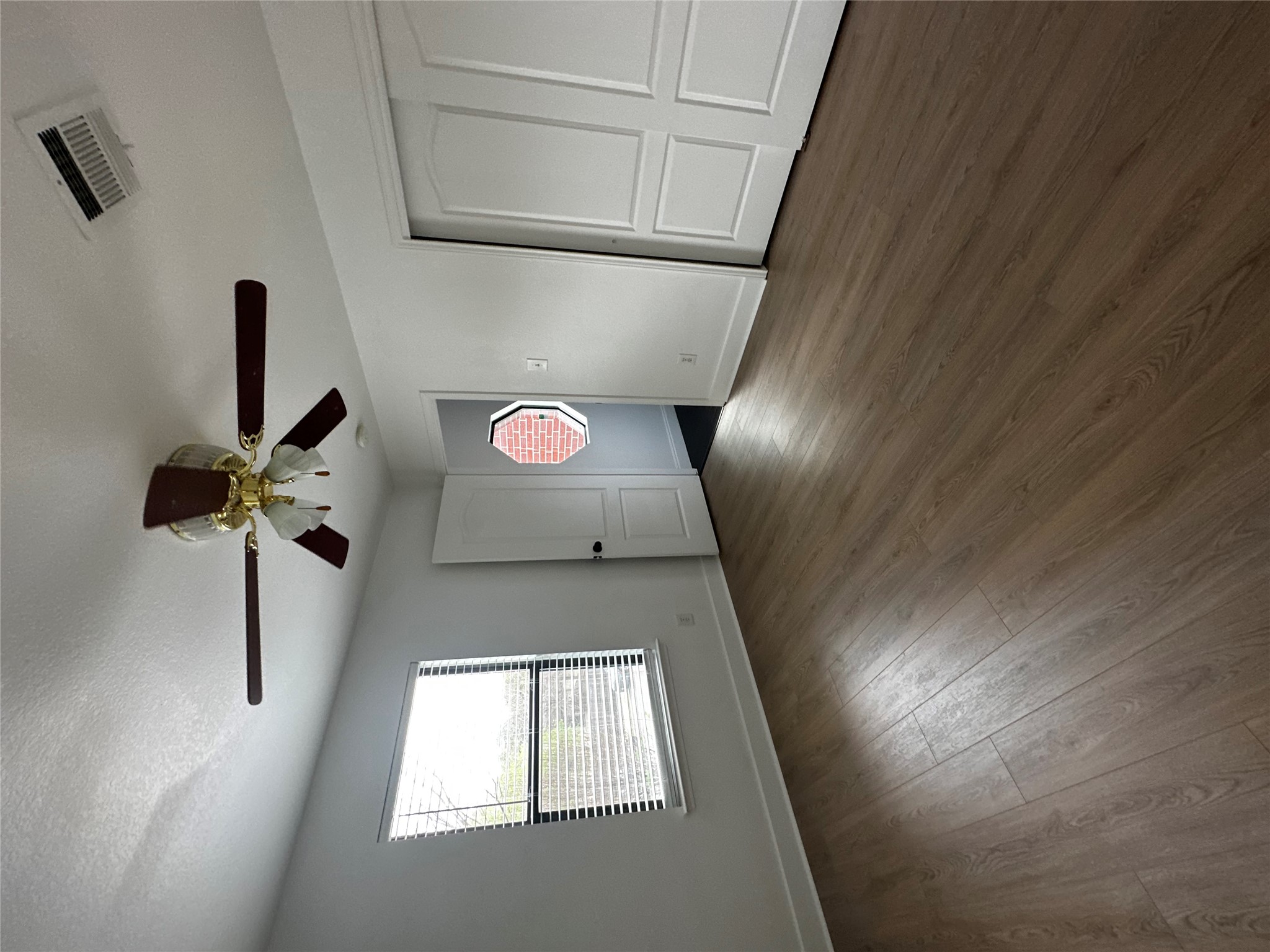 8016 Bannock Lane Austin, TX 78747 - Photo 25 of 32 a view of an empty room with wooden floor and a window