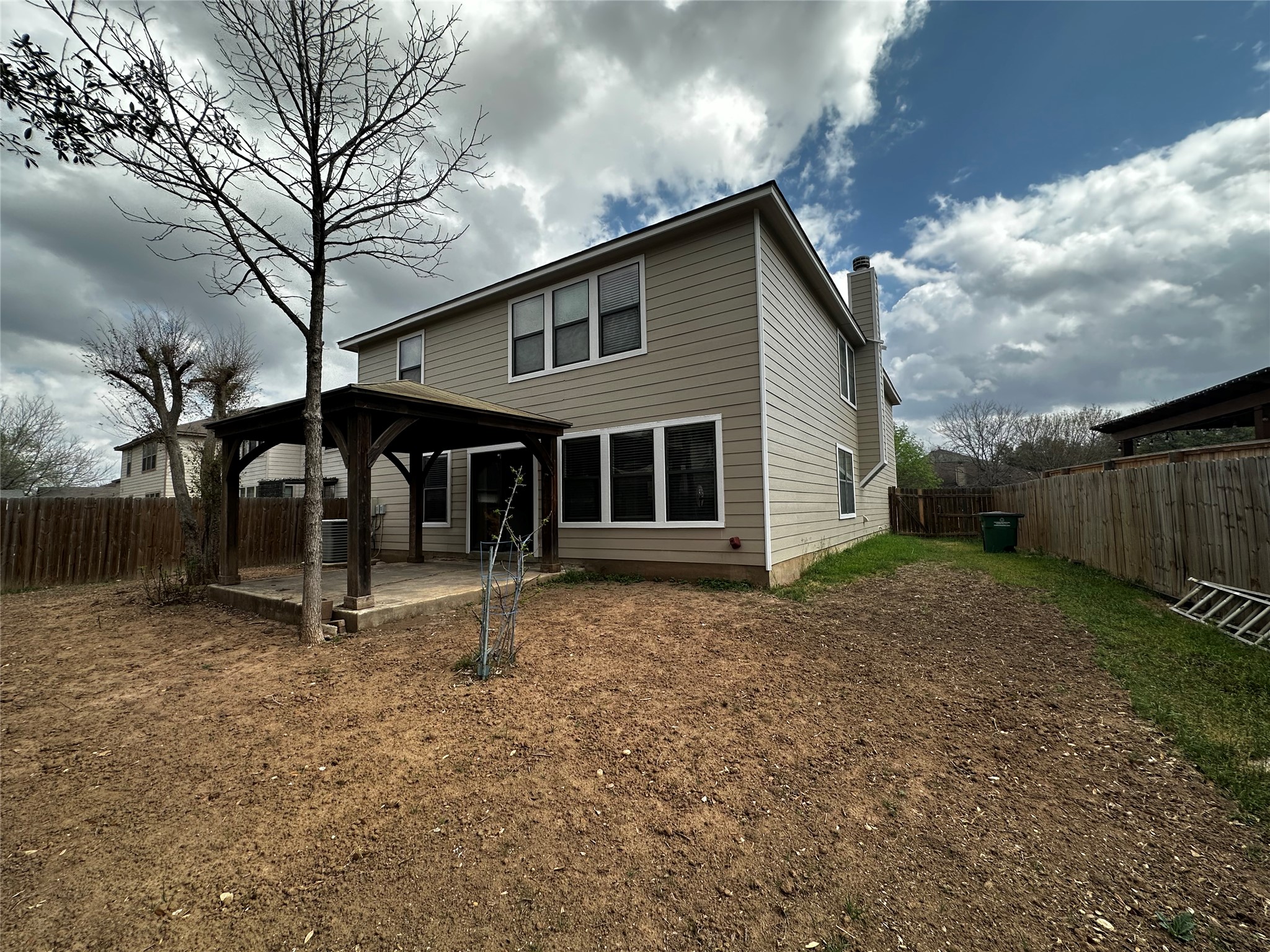 8016 Bannock Lane Austin, TX 78747 - Photo 27 of 32 a view of a house with backyard and trees