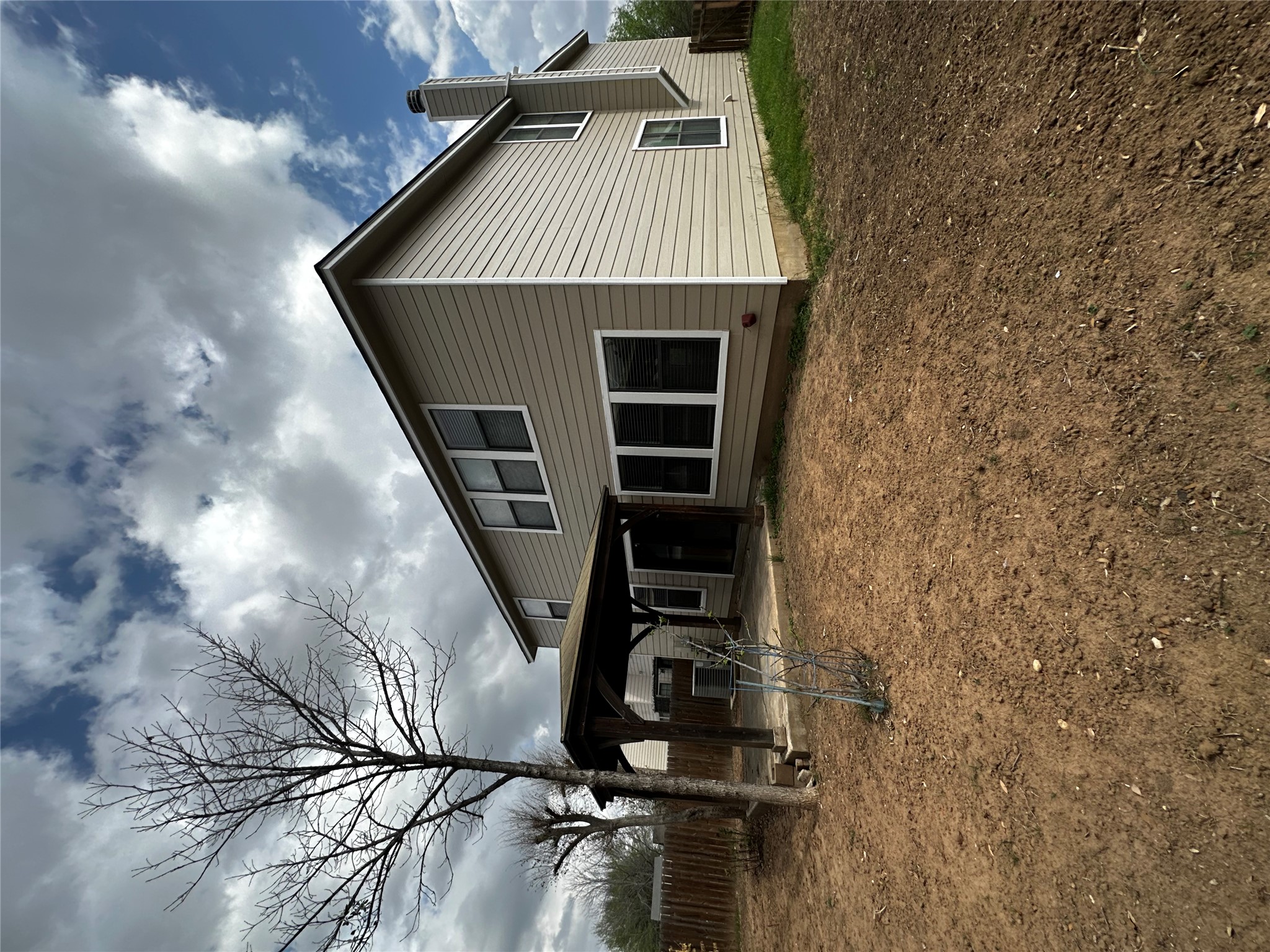 8016 Bannock Lane Austin, TX 78747 - Photo 28 of 32 a front view of a house with garden
