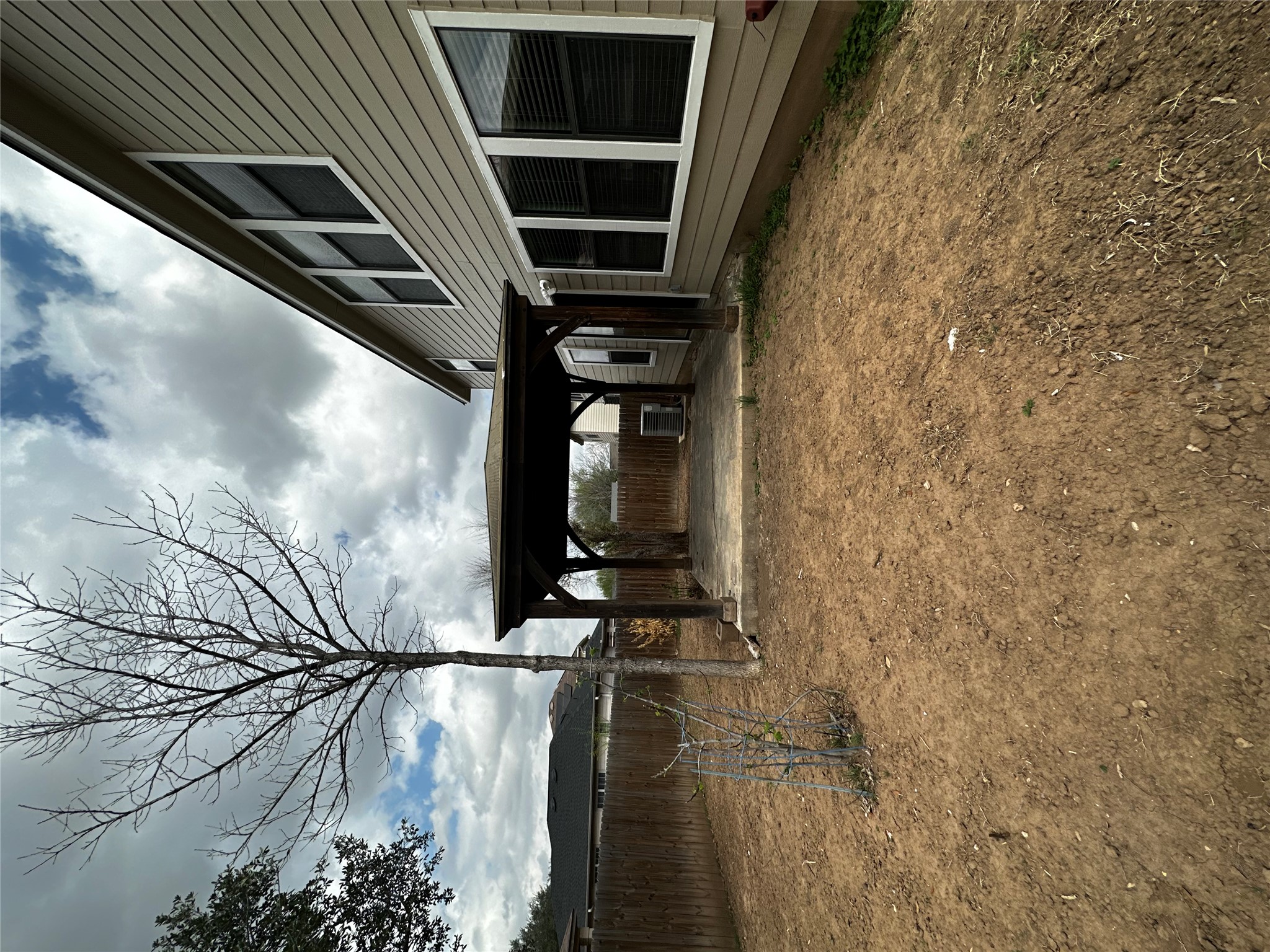 8016 Bannock Lane Austin, TX 78747 - Photo 29 of 32 a view of a house with a yard