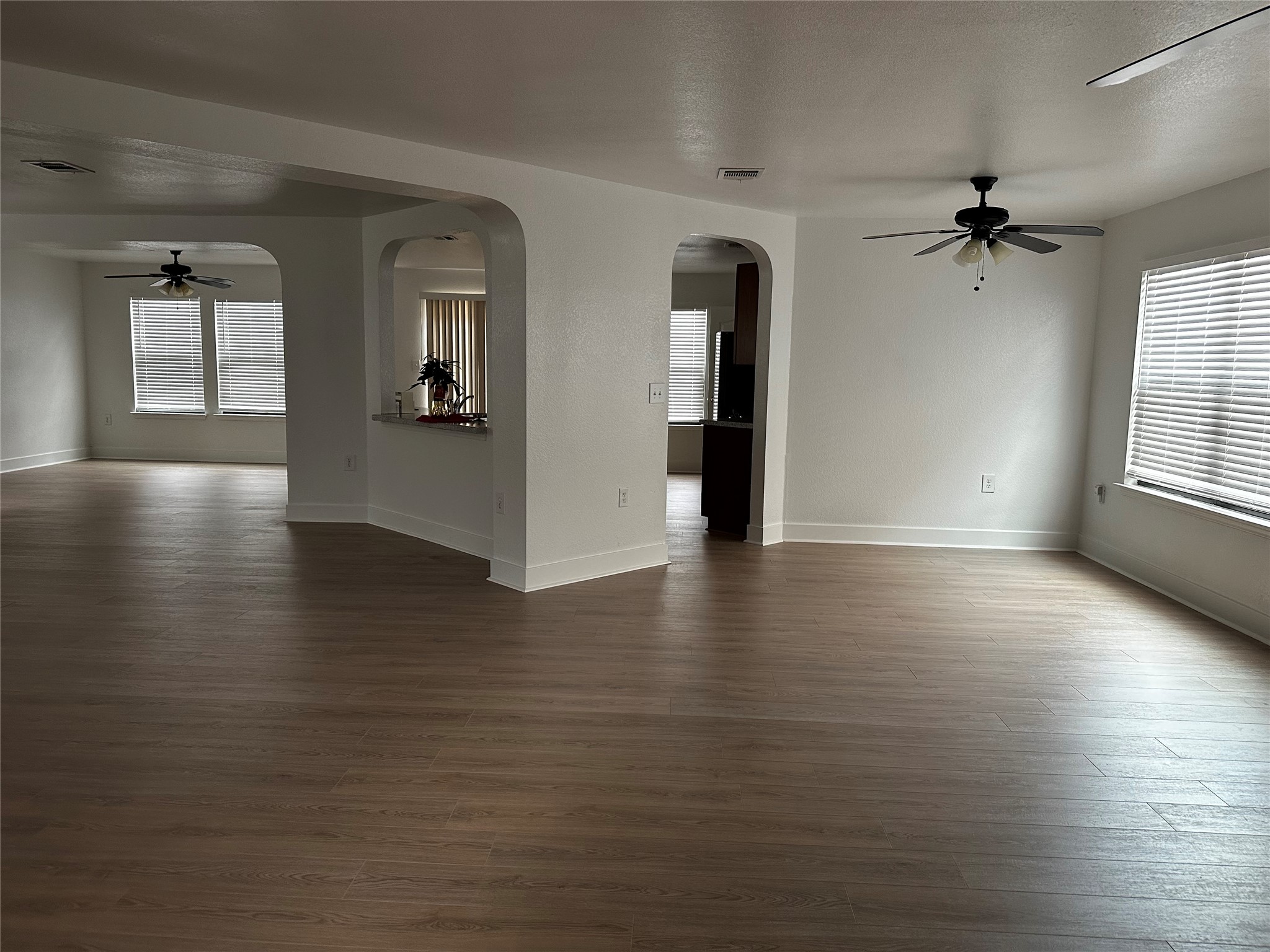 8016 Bannock Lane Austin, TX 78747 - Photo 4 of 32 wooden floor in an empty room with a window