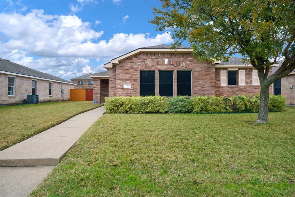 14813 North Spring Ridge Circle Balch Springs, TX 75180 - Photo 2 of 22 a front view of house with yard and trees