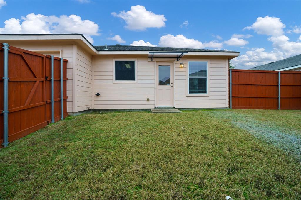 14813 North Spring Ridge Circle Balch Springs, TX 75180 - Photo 21 of 22 a view of a house with a yard