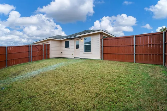 a view of a backyard with a garden