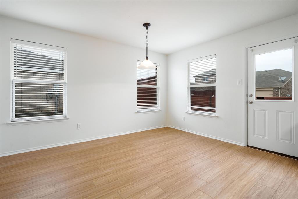 14813 North Spring Ridge Circle Balch Springs, TX 75180 - Photo 8 of 22 a view of a room window and wooden floor