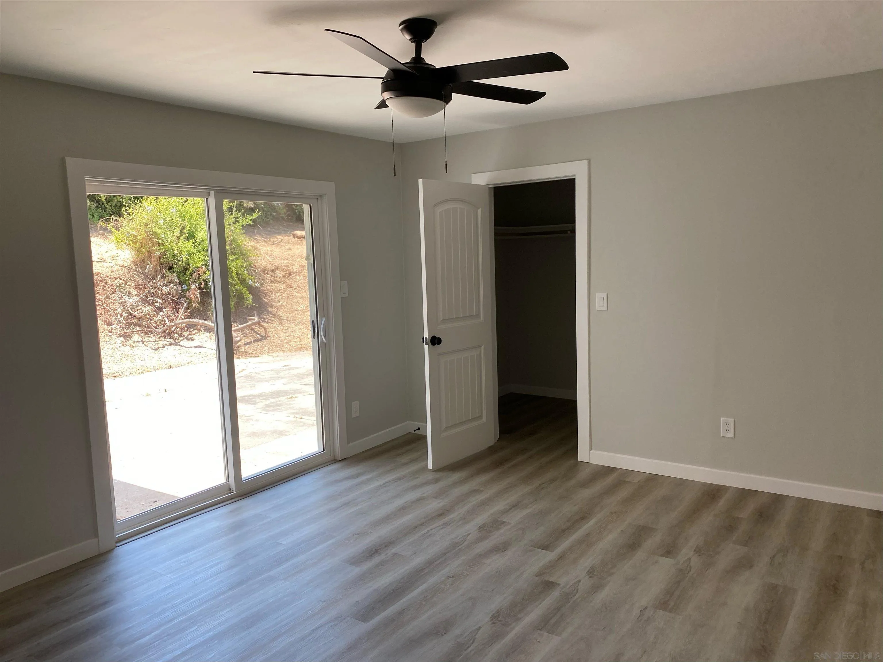 3866 Spring Drive Spring Valley, CA 91977 - Photo 6 of 9 wooden floor in an empty room with a window
