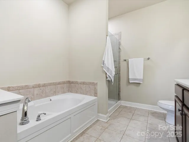 a bathroom with a bathtub and a toilet