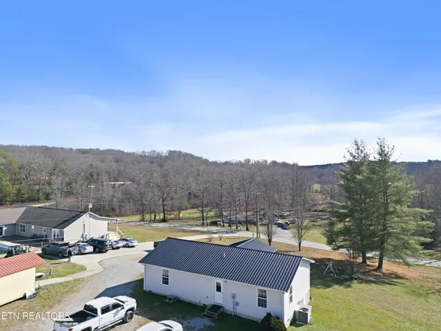 a view of houses with a swimming pool