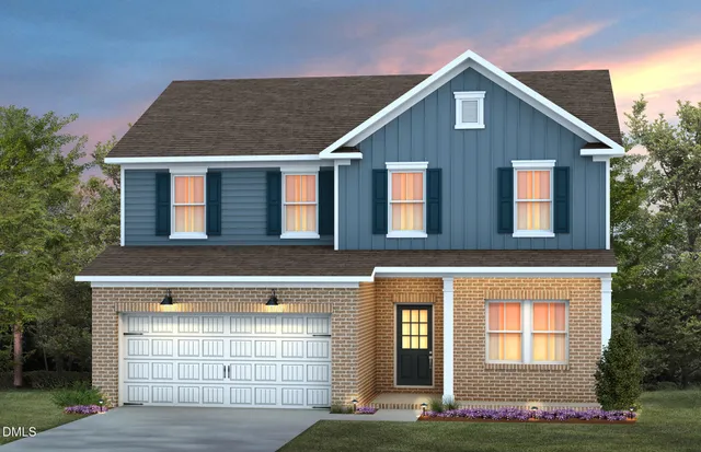 a front view of a house with yard