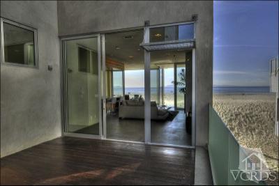 1013 Mandalay Beach Road Oxnard, CA 93035 - Photo 5 of 30 a view of a hallway with wooden floor fireplace and living room