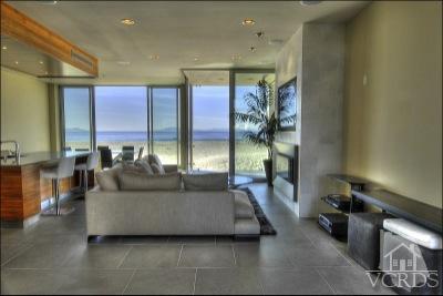 1013 Mandalay Beach Road Oxnard, CA 93035 - Photo 7 of 30 a living room with furniture and a chandelier