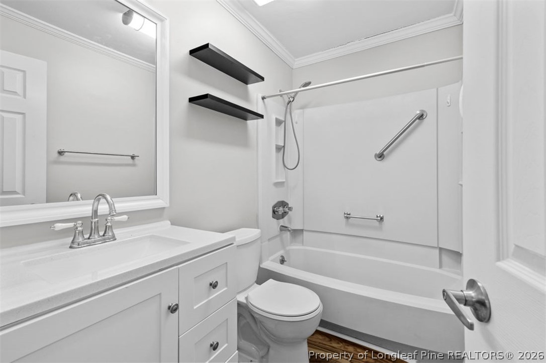 3305 Hunting Bay Drive Spring Lake, NC 28390 - Photo 19 of 27 a bathroom with a sink a toilet and a bathtub