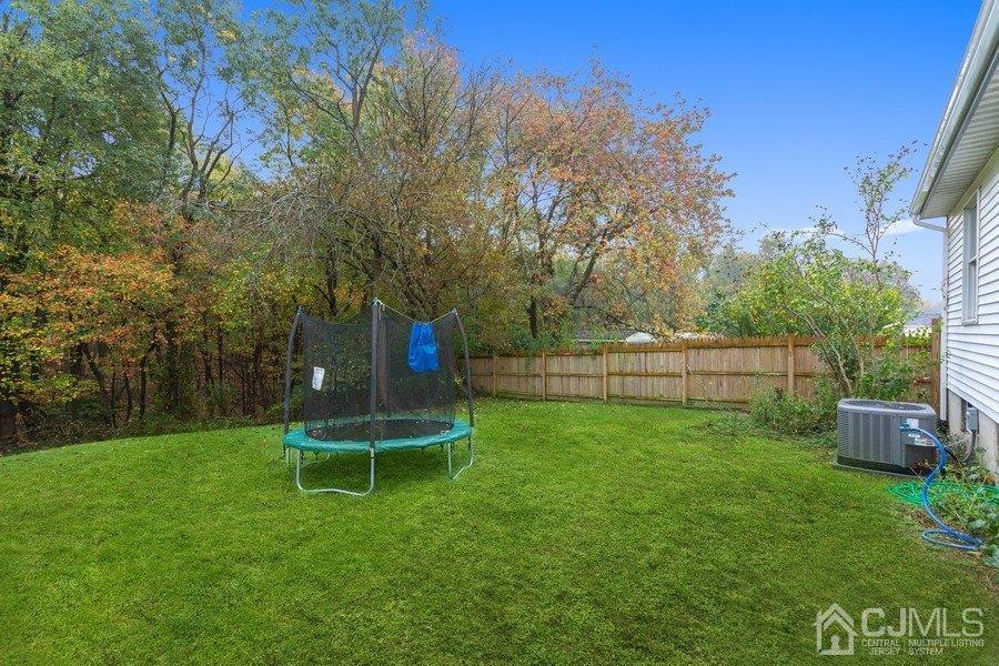 20 Brandeis Road Old Bridge, NJ 08859 - Photo 18 of 18 a backyard of a house with lots of green space