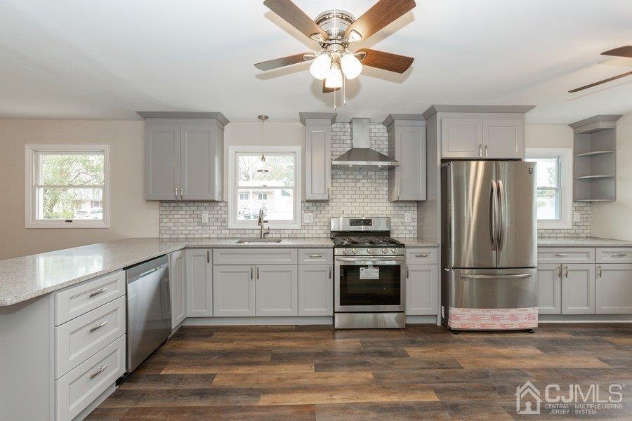 20 Brandeis Road Old Bridge, NJ 08859 - Photo 3 of 18 a kitchen with stainless steel appliances granite countertop a refrigerator a stove a sink and a refrigerator