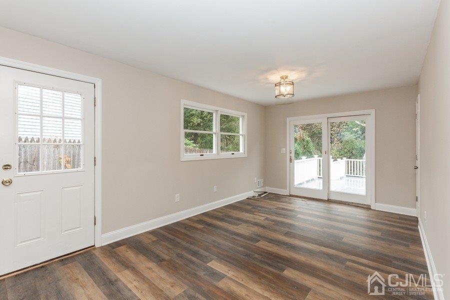 20 Brandeis Road Old Bridge, NJ 08859 - Photo 6 of 18 a view of an empty room with wooden floor and a window