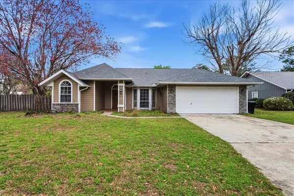 a front view of a house with yard