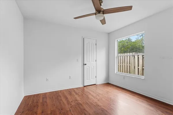 a view of an empty room with a window