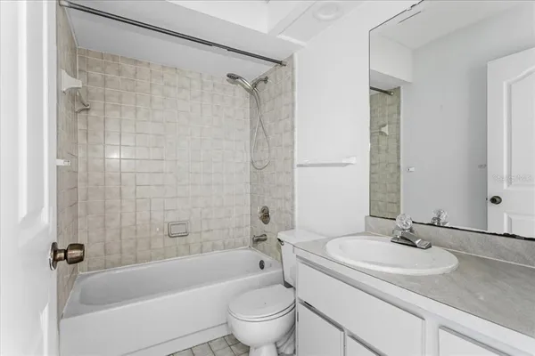 a bathroom with a sink a toilet and a bathtub