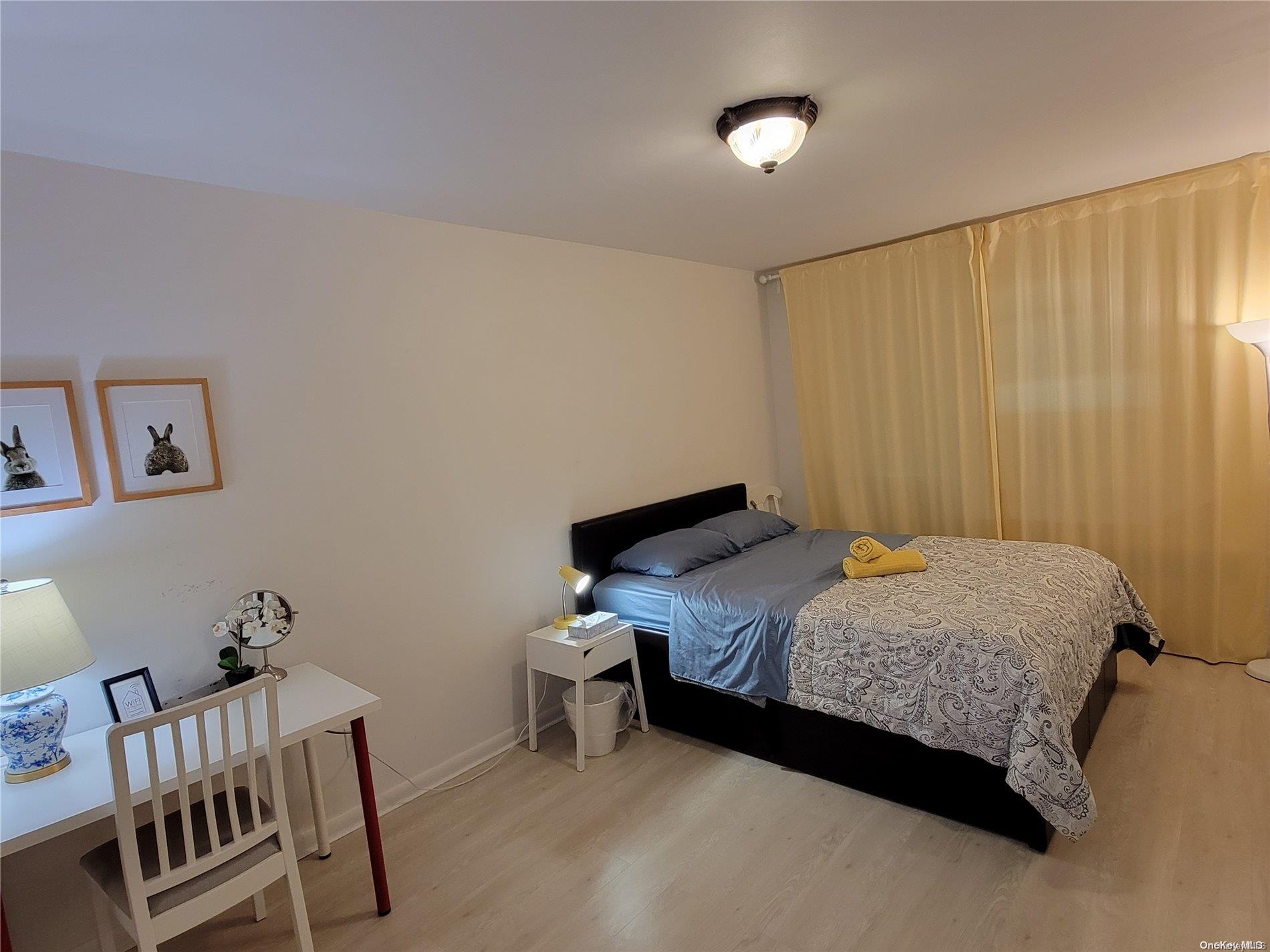 85-19 75th Street Queens, NY 11421 - Photo 14 of 17 a bedroom with a bed and a furniture