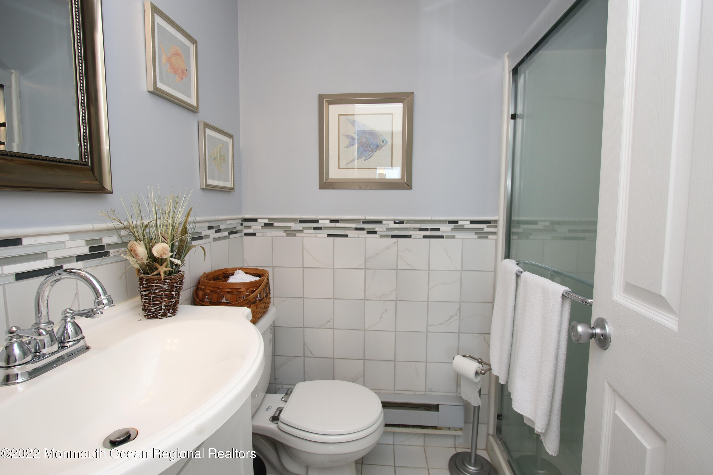 1401 Long Beach Boulevard Beach Haven, NJ 08008 - Photo 12 of 17 a bathroom with a sink mirror and toilet