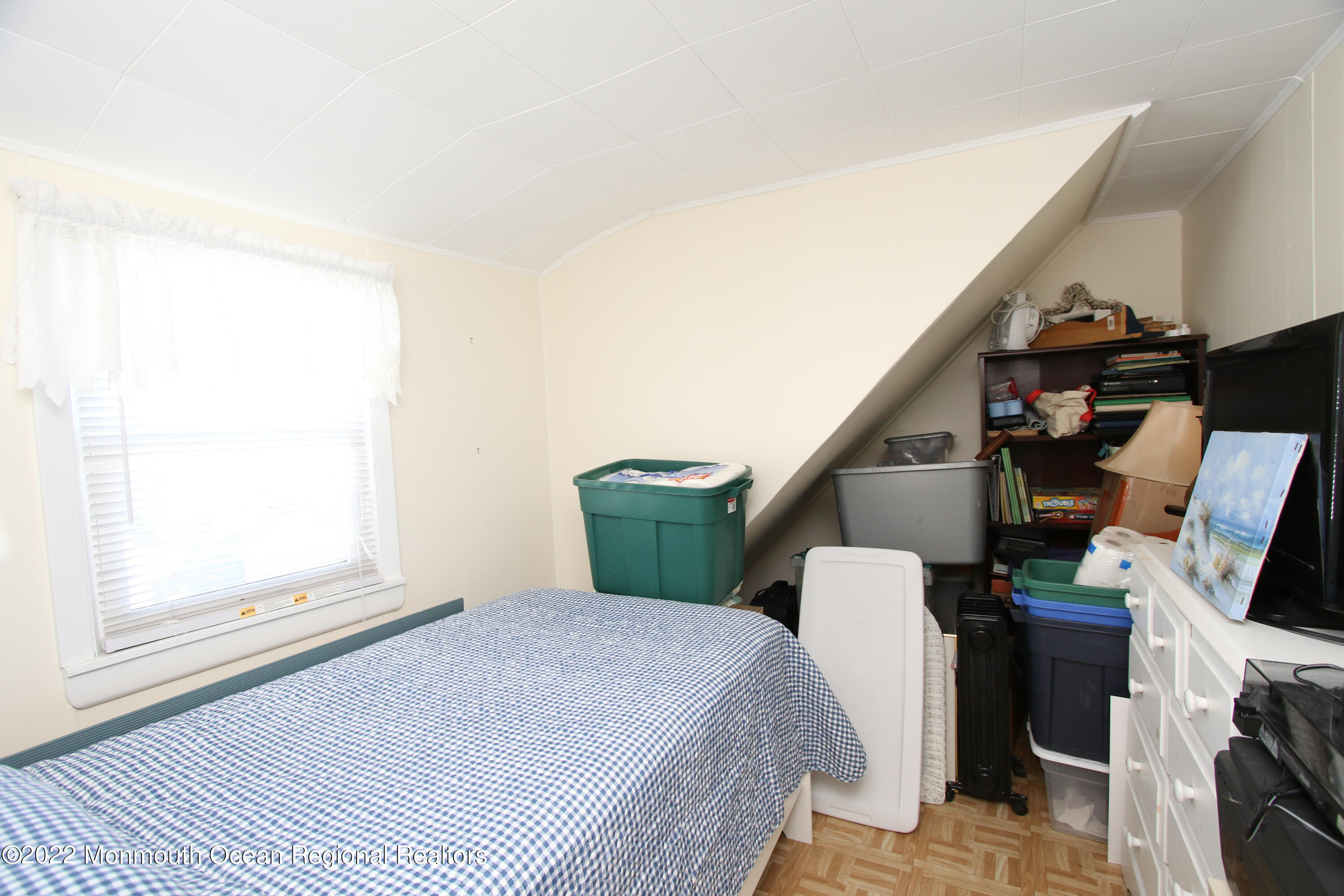 1401 Long Beach Boulevard Beach Haven, NJ 08008 - Photo 16 of 17 a bedroom with a bed a flat screen tv and balcony view