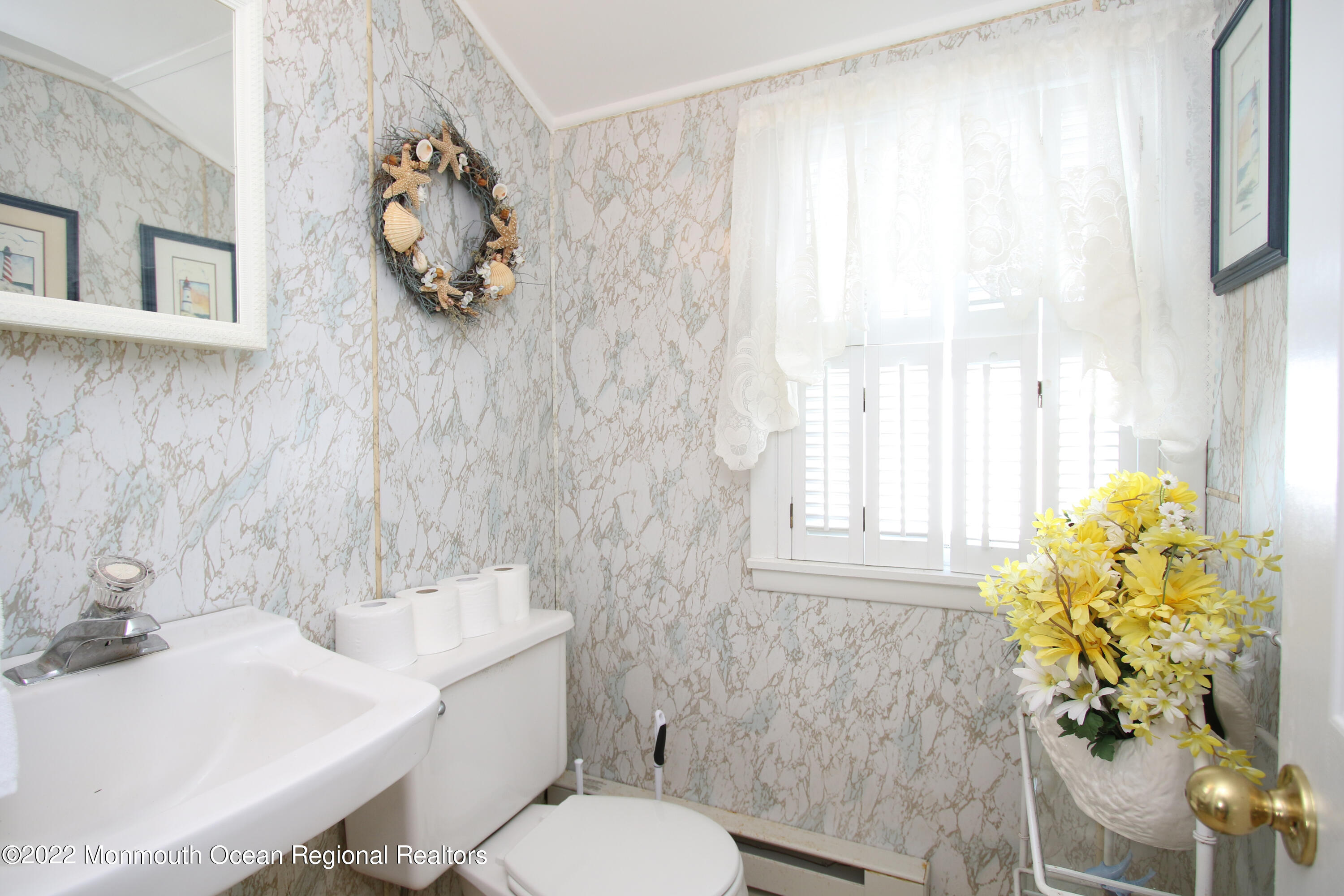 1401 Long Beach Boulevard Beach Haven, NJ 08008 - Photo 17 of 17 a bathroom with a sink toilet and window
