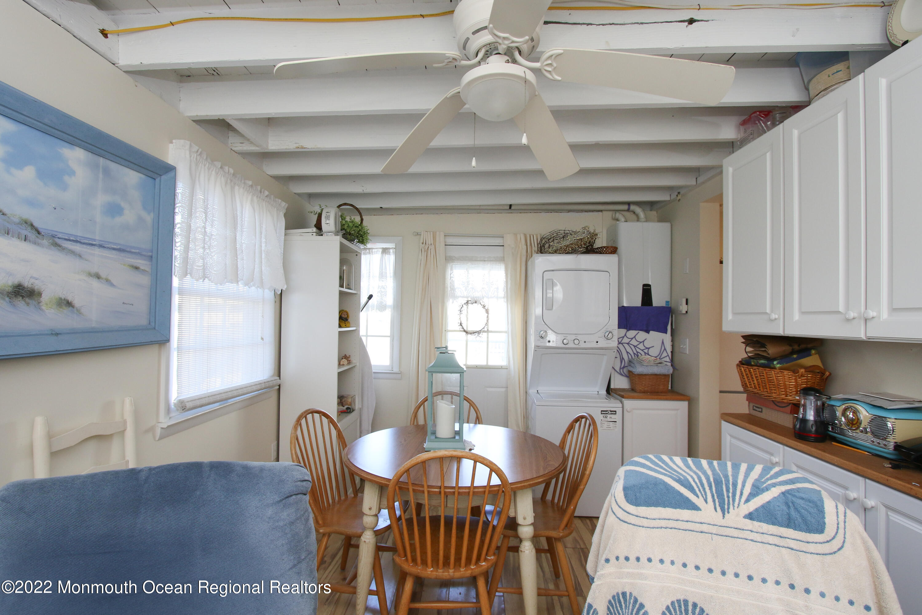 1401 Long Beach Boulevard Beach Haven, NJ 08008 - Photo 9 of 17 a view of a dining room with furniture window and wooden floor