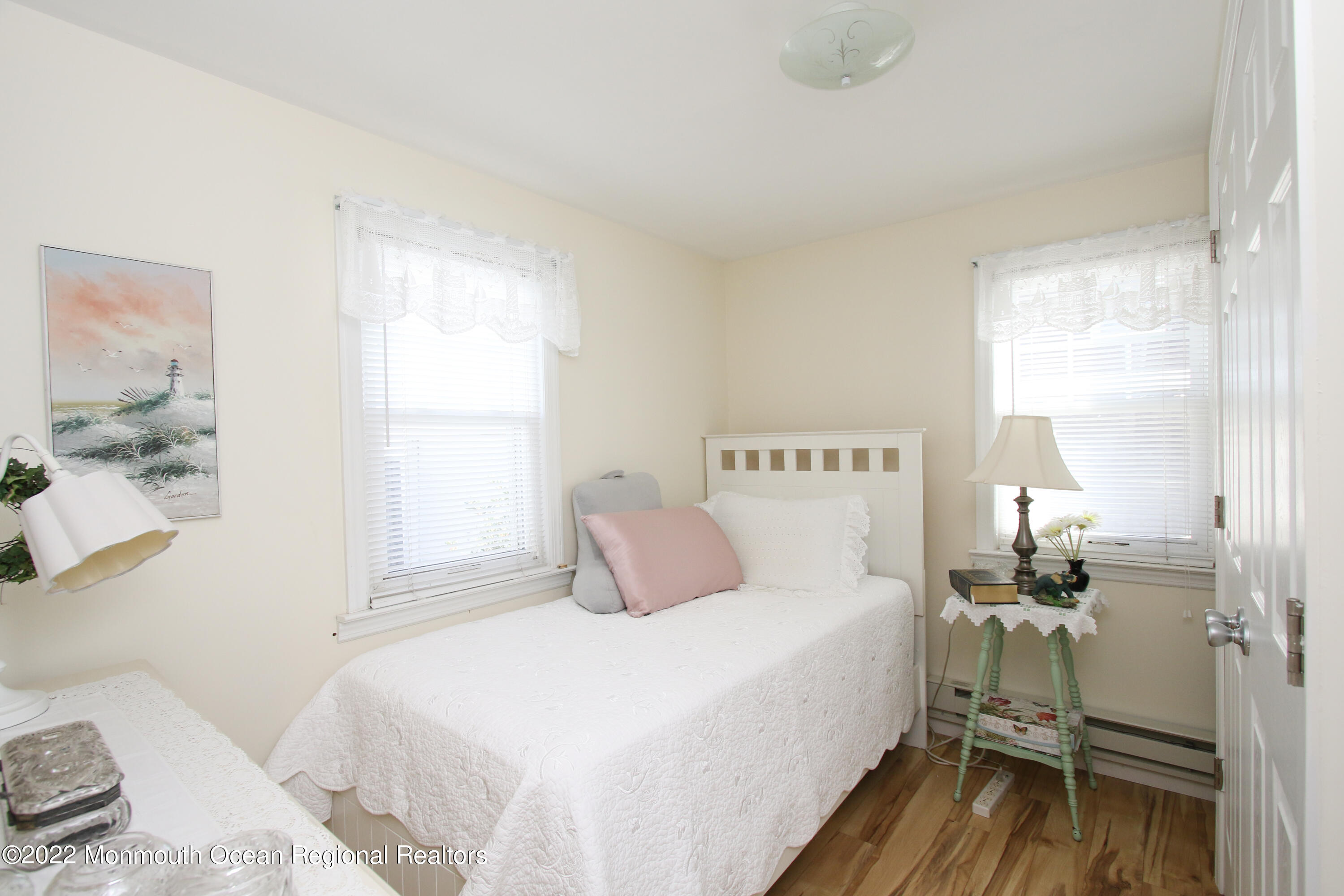 1401 Long Beach Boulevard Beach Haven, NJ 08008 - Photo 10 of 17 a bedroom with a bed and a window
