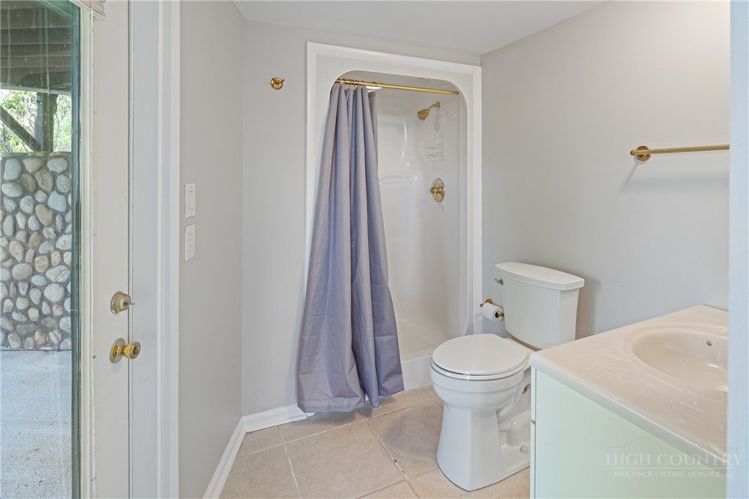 146 Cherokee Lane Purlear, NC 28665 - Photo 27 of 49 a bathroom with a toilet and a sink