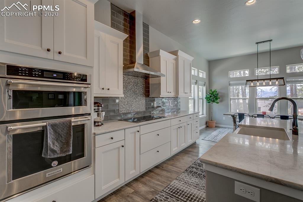 16430 Dancing Bear Lane Monument, CO 80132 - Photo 12 of 50 a kitchen with sink stove and cabinets