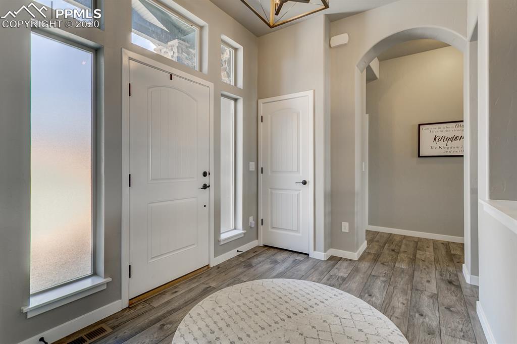 16430 Dancing Bear Lane Monument, CO 80132 - Photo 17 of 50 a view of livingroom with hardwood floor and hallway
