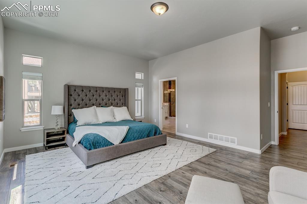16430 Dancing Bear Lane Monument, CO 80132 - Photo 20 of 50 a bed sitting in a bedroom and view of living room